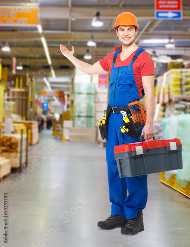 Photo: Handyman with tools full portrait Handyman with tools full portrait