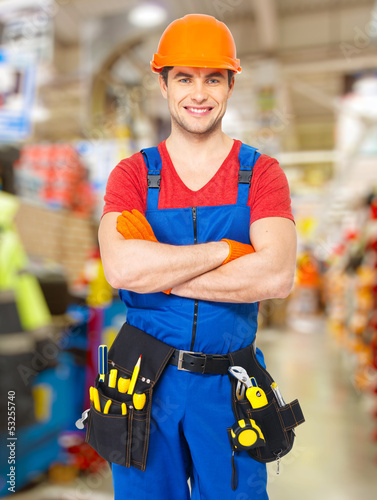 Photo: Portrait of smiling handyman with tools Portrait of smiling handyman with tools