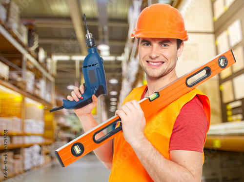 Photo: manual worker with tools at warehouse manual worker with tools at warehouse