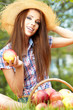 Photo: Apple woman. Very beautiful ethnic model eating red apple in the Apple woman. Very beautiful ethnic model eating red apple in the