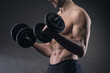 Photo: Exercising biceps with dumbbells Exercising biceps with dumbbells