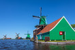 Photo: Ancient Dutch wooden windmills at the Zaanse Schans Ancient Dutch wooden windmills at the Zaanse Schans
