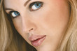 Close up of beautiful young woman with blue eyes