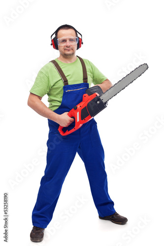 Photo: Male lumberyard worker with chainsaw Male lumberyard worker with chainsaw
