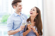 Couple drinking wine in modern apartment