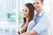 Couple hugging in new apartment