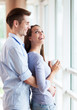 Couple hugging in new apartment