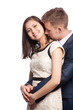 Man kissing his wife's neck