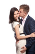 Man kissing his girlfriend on the cheek