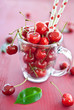 Fresh cherries in a glass mug