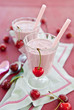 Two glasses with cherry milkshake