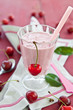 A glass of cherry milkschake