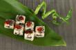Tasty Maki sushi - Roll on green leaf on mat