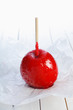 Photo: Colourful toffee apple on a stick Colourful toffee apple on a stick