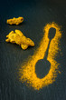 Spice turmeric on a blackboard chalk