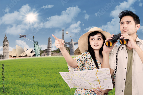 Photo: Asian couple travel around the world Asian couple travel around the world