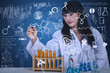 Beautiful scientist drawing formula at lab