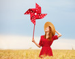 Photo: Redhead girl with toy wind turbine Redhead girl with toy wind turbine