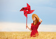 Photo: Redhead girl with toy wind turbine Redhead girl with toy wind turbine