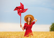 Photo: Redhead girl with toy wind turbine Redhead girl with toy wind turbine