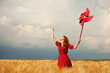Photo: Redhead girl with toy wind turbine Redhead girl with toy wind turbine