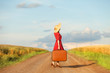 Redhead girl with suitcase at outdoor.