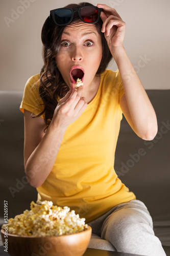 Photo: Shocked young woman watching 3D movie Shocked young woman watching 3D movie