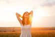 Redhead girl at in sunrise light