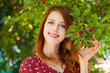 Redhead girl near cherry