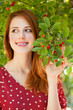 Redhead girl near cherry