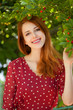 Redhead girl near cherry