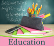 Back to school - blackboard with pencil-box and school