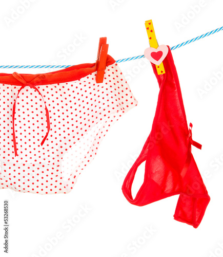 Photo: Women's panties hanging on rope isolated on white Women's panties hanging on rope isolated on white
