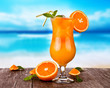 Summer drink with blur beach on background