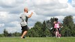 Father Celebrates Daughter Riding Bike Without Training Wheels