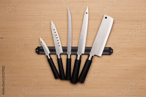 Photo: Set of knives on a magnetic holder Set of knives on a magnetic holder