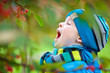 Cute little boy having fun in a garden