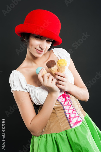 Photo: Pretty girl in german style with ice cream Pretty girl in german style with ice cream