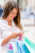 Shopping woman texting