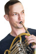 Caucasian male musician playing horn isolated on white