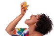 Photo: Overweight young black woman drinking orange juice - African peo Overweight young black woman drinking orange juice - African peo