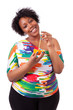 Photo: Overweight young black woman drinking orange juice - African peo Overweight young black woman drinking orange juice - African peo