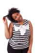 Photo: Young fatty black woman holding her hairs - African people Young fatty black woman holding her hairs - African people