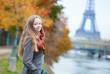 Beautiful young lady on a fall day in Paris