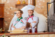 Foto: Portrait of two cooks with crossed arms Portrait of two cooks with crossed arms