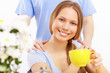 Photo: Beautiful young woman drinking tea Beautiful young woman drinking tea