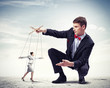 Businessman puppeteer