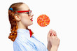 Young woman holding candy