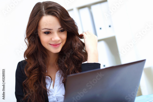 Photo: Young busines woman with notebook Young busines woman with notebook