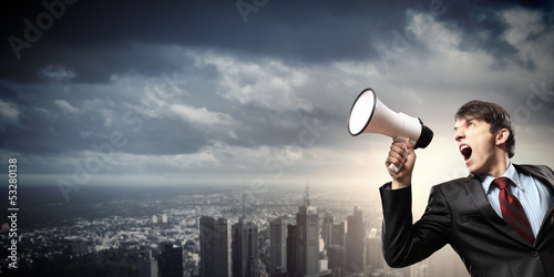 Photo: businessman with megaphone businessman with megaphone